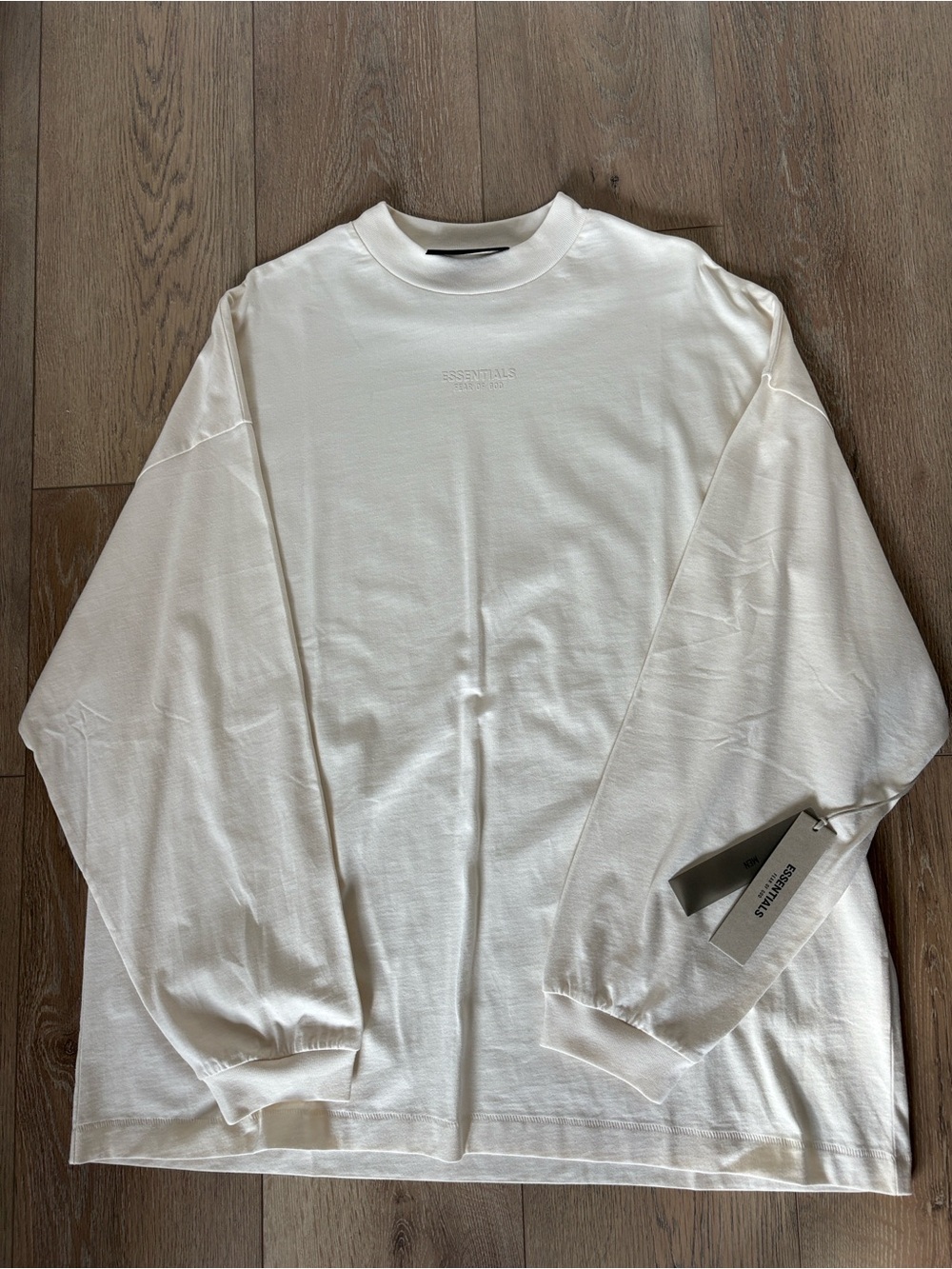 Essentials Long Sleeve Crewneck Shirt in “Cloud Dancer” cream